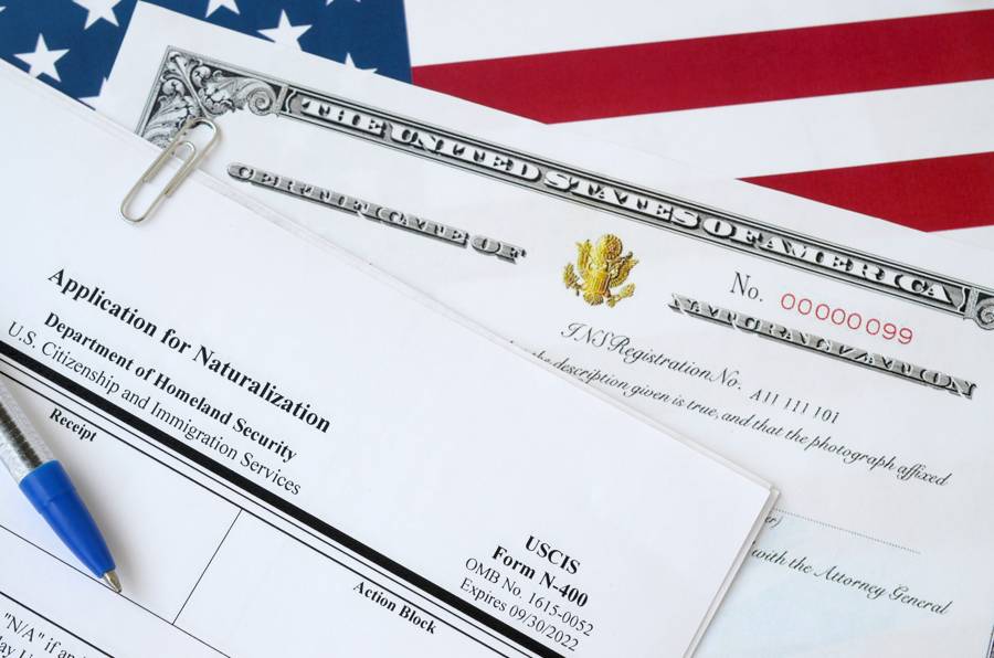 A naturalization application on top of an American flag