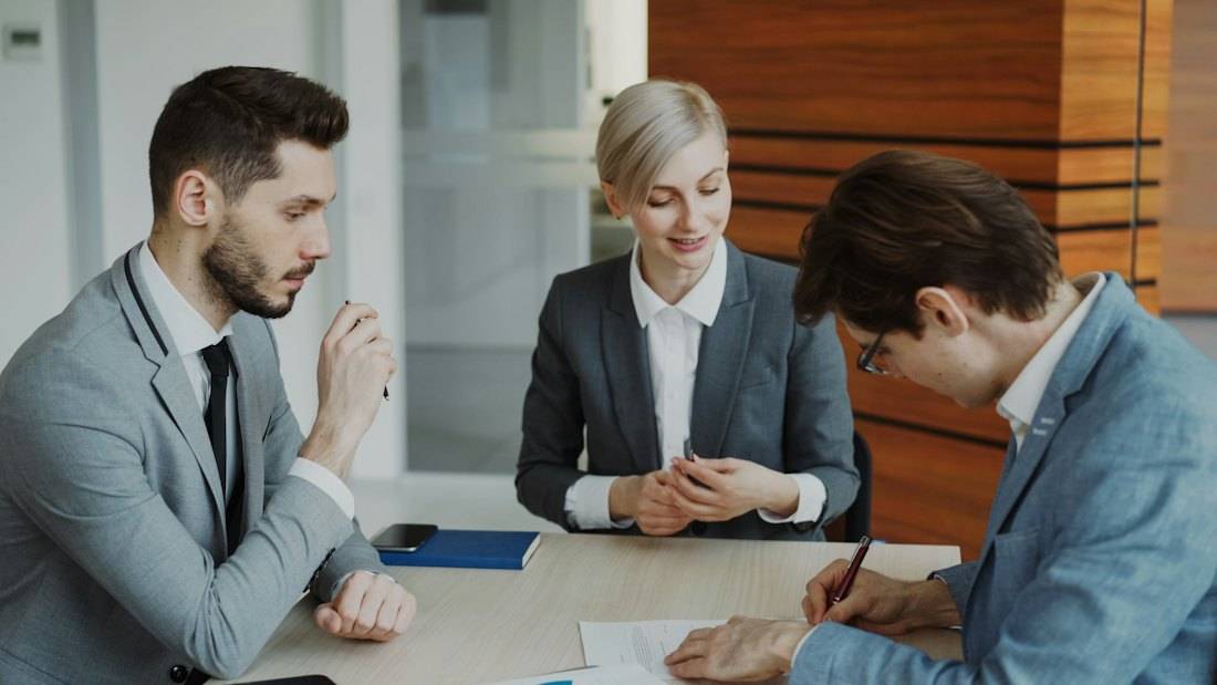 Lawyers going over papers at a table