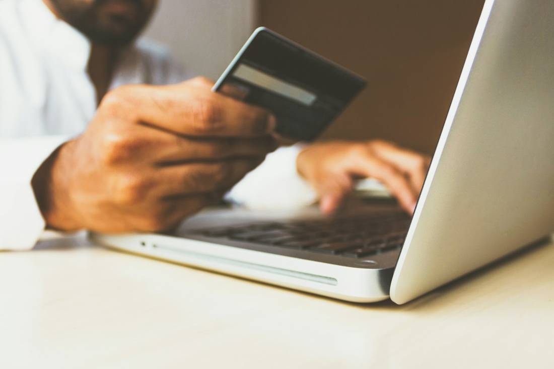 A person paying online with a card