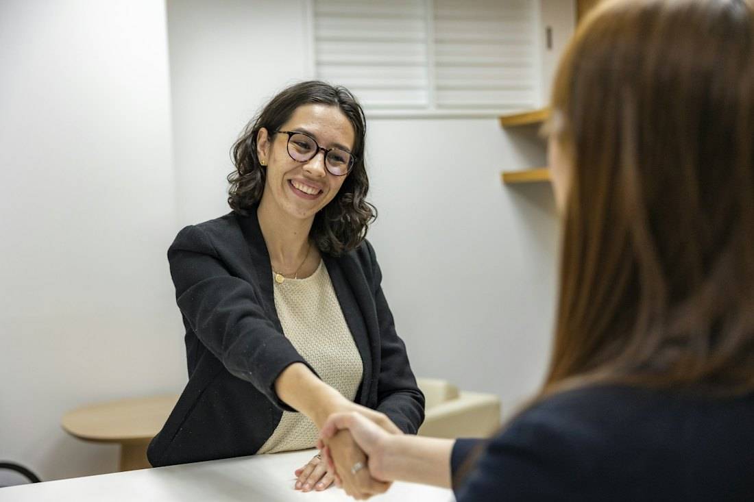 A lawyer shaking hands with a client